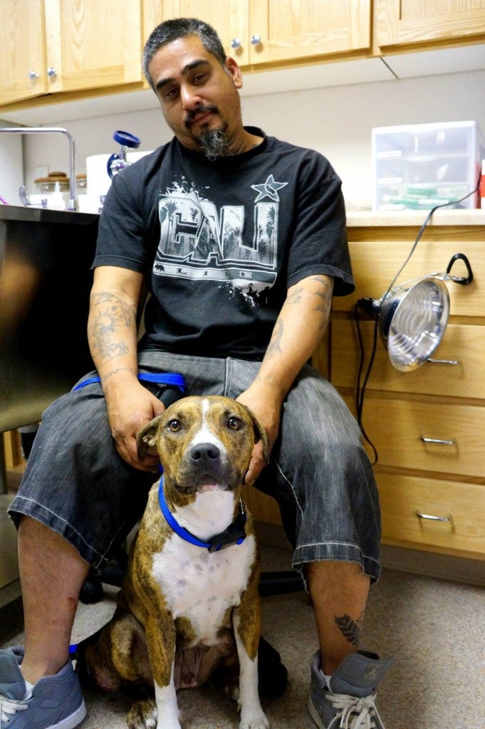 A Mercer client and his dog waiting to finish their visit at the clinic.